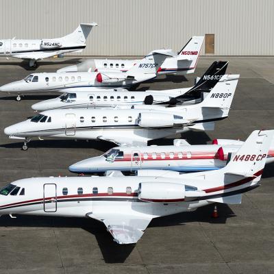 A row of private business jets in an airport in King County, Seattle.