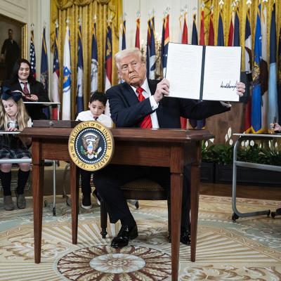 US President, Donald Trump, displaying a signed executive order aimed at closing the Education Department during an event at the White House on March 20, 2025 in Washington, D.C.