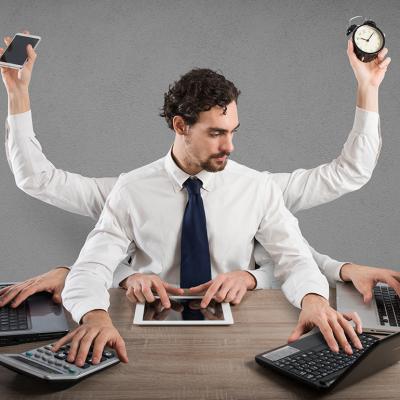 A businessman illustrated with multiple arms and hands as a concept of multitasking.