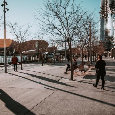 People along a walkway during wintertime.