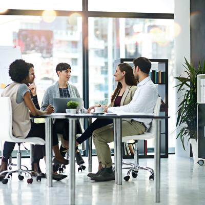 A group of businesspeople having a meeting together in a modern office