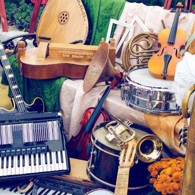 A pile of different musical instruments.