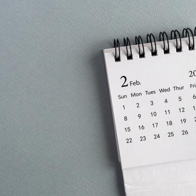 A small desk calendar showing February 2026.