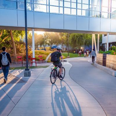 People walking and cycling around the Google headquarters.