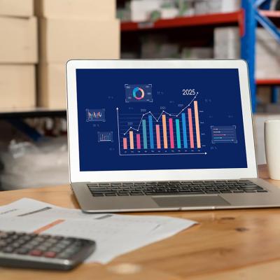 Data dashboard displayed on a laptop inside a warehouse.