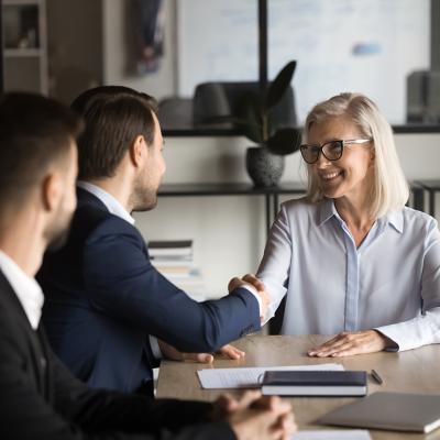 Business partners shaking hands during a meeting.