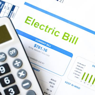 A calculator and an electric bill.