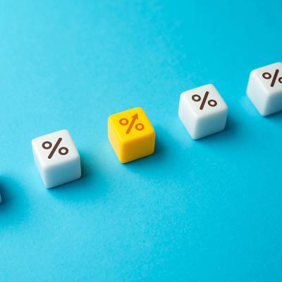 Interest rate represented by dice with percentage symbols.