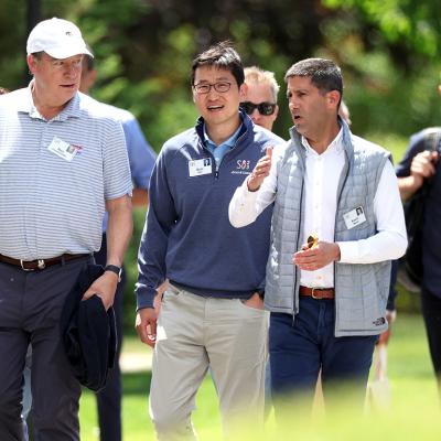 Bom Kim (center), founder and CEO of Coupang, walks with investor Stan Druckenmiller and member of the Federal Reserve Board of Governors Kevin Warsh during the Allen & Company's annual Sun Valley Conference on July 13, 2023 in Sun Valley, Idaho.