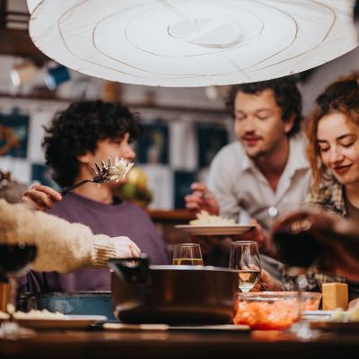 A group of friends having a dinner party.