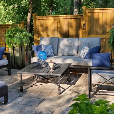 A patio with modern furniture during the afternoon.