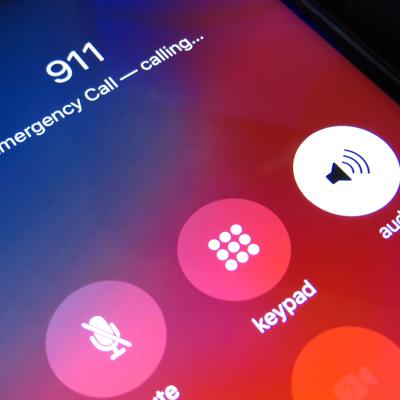 Emergency call to 911 on a smartphone screen.