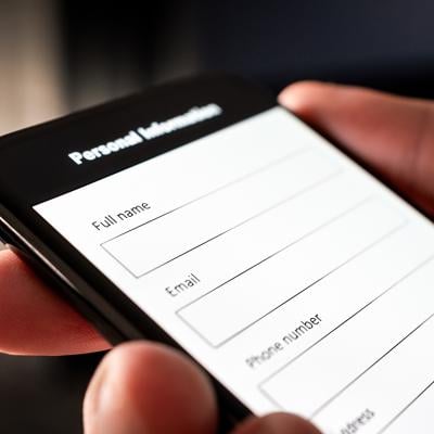 A user filling out the personal information part of an online survey using a smartphone.
