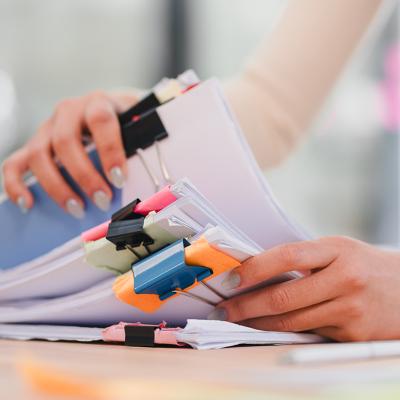 Person organizing sets of documents.