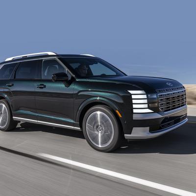 A Hyundai Palisade Hybrid SUV on the road.