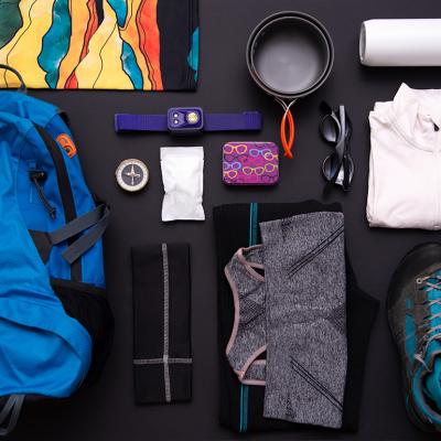 A flat lay set of hiking gear and essentials.