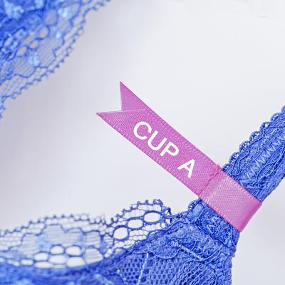 A pink 'cup A' label on a lace bra.