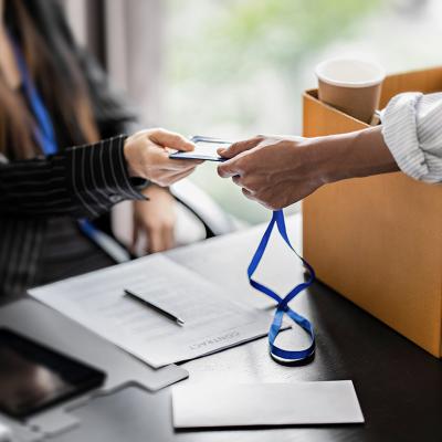 Employee handing in company ID during resignation.