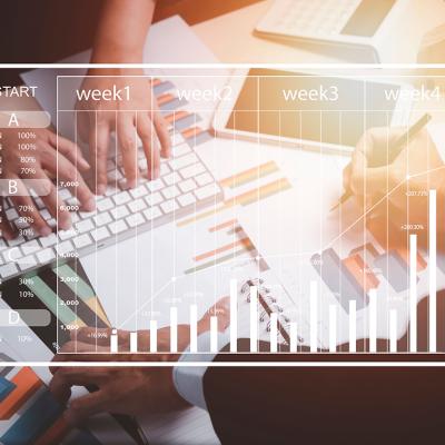 A business team working on charts and reports illustrated with a weekly calendar graphic.