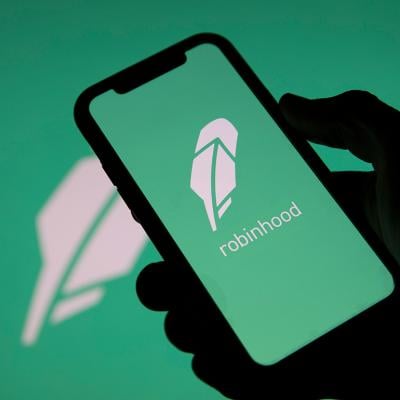 Robinhood, a financial investing app, and its logo displayed on a smartphone.