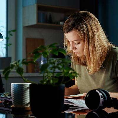A woman busy working from home.