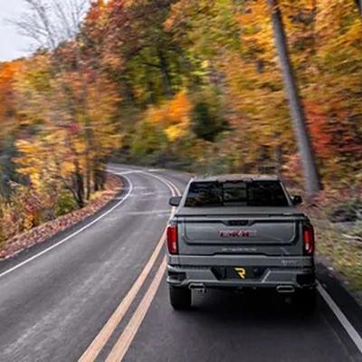 A truck driving down a highway.
