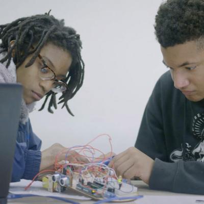 Students at Latitude High School in Oakland, CA collaborate on designing an autonomous vehicle to aid senior citizens.