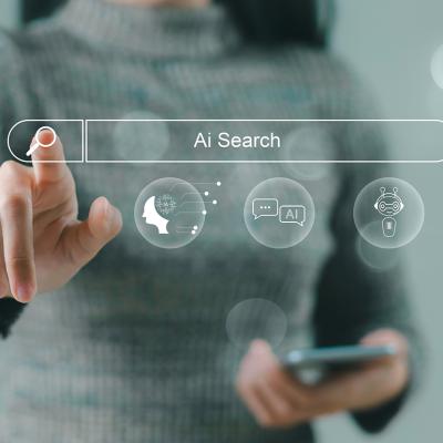 A businesswoman using a smartphone navigating a holographic AI search engine bar.