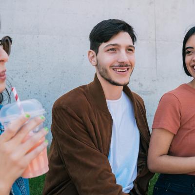 A group of friends having fun together over drinks. 