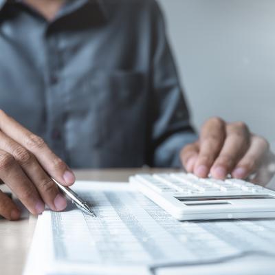 An accountant analyzing financial documents. 
