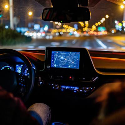 An interior view of a person driving a modern car.