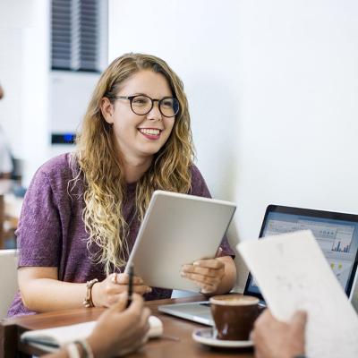 Young colleagues engaged in a discussion with a senior professional.