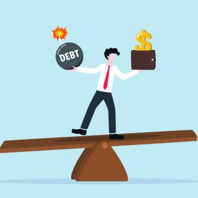 A vector illustration showing a person balancing on a seesaw of a debt bomb and a money wallet.