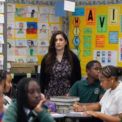 A 7th and 8th grade social studies teacher overseeing her class.
