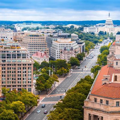 An aerial shot of Pennsylvania Avenue and a view of U.S. Capitol. 