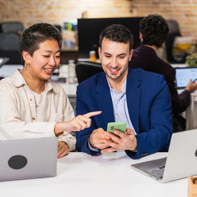 A diverse business team working together on a project in an office.
