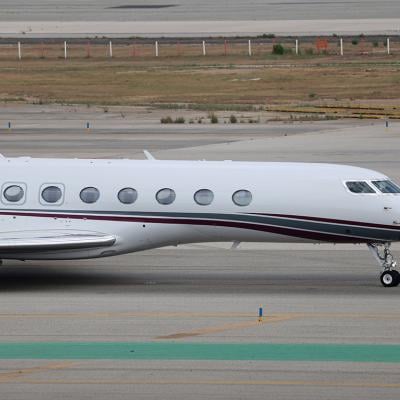 The Qatar Amiri Flight Gulfstream G700 on a runway in Barcelona-El Prat Airport in Spain.