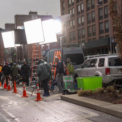 Lights and crew men during a filmmaking in Chelsea neighborhood, New York, USA.