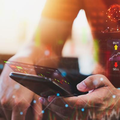 Person analyzing cryptocurrency data on a phone.