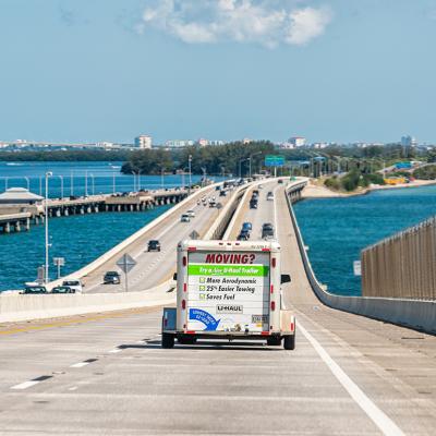 A U-Haul trailer truck crossing the Tampa Bay bridge in Florida.