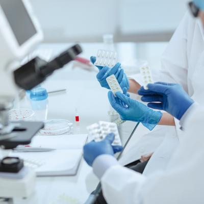 Pharmacists reviewing a new drug in a laboratory.