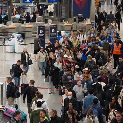 ravelers wait in long lines at Hartsfield-Jackson Atlanta International Airport on March 16, 2026 in Atlanta, Georgia. 