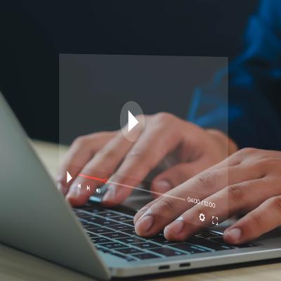 Graphic of a YouTube video screen over a person using a laptop.