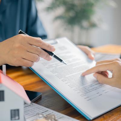 Broker showing a client a contract.