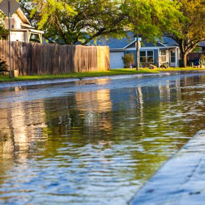 A shallow flood formed along a neighborhood after a thunderstorm.