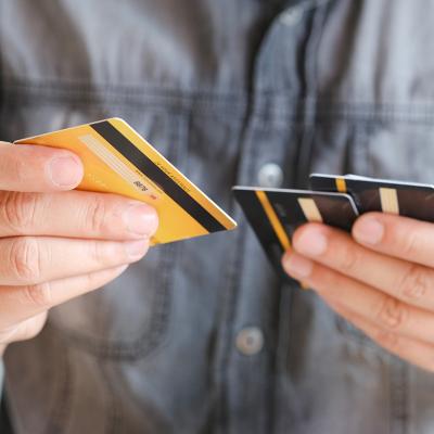 Man choosing from several credit cards.