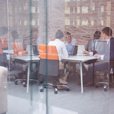 A group of business people during a meeting from a modern office.