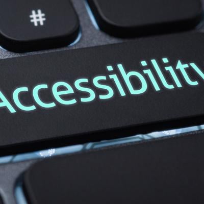 An illuminated keyboard cap labeled with Accessibility. 