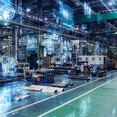 Large digital machines and tools inside a manufacturing warehouse.