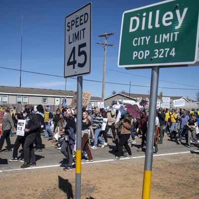 Denouncing detention of 5-year-old Liam Ramos, protesters march toward the South Texas Family Residential Center on January 28, 2026 in Dilley, Texas.